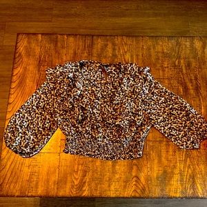 This a black see through shirt with flower all over